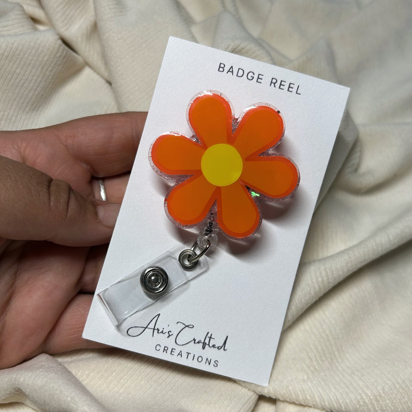 orange flower - badge reel