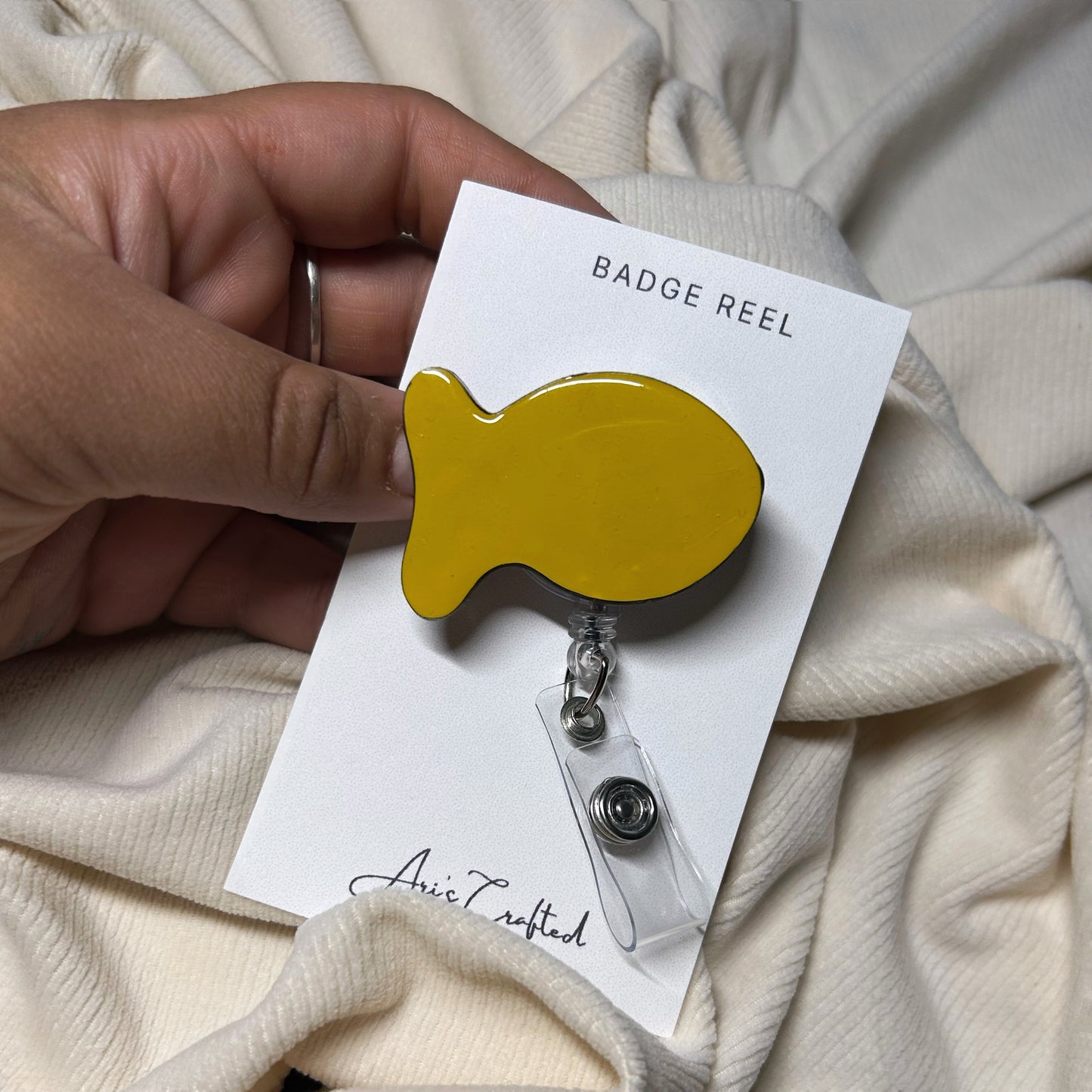 goldfish - badge reel