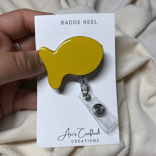 goldfish - badge reel